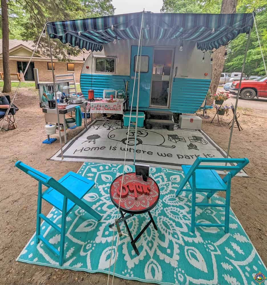vintage camper set up with awning