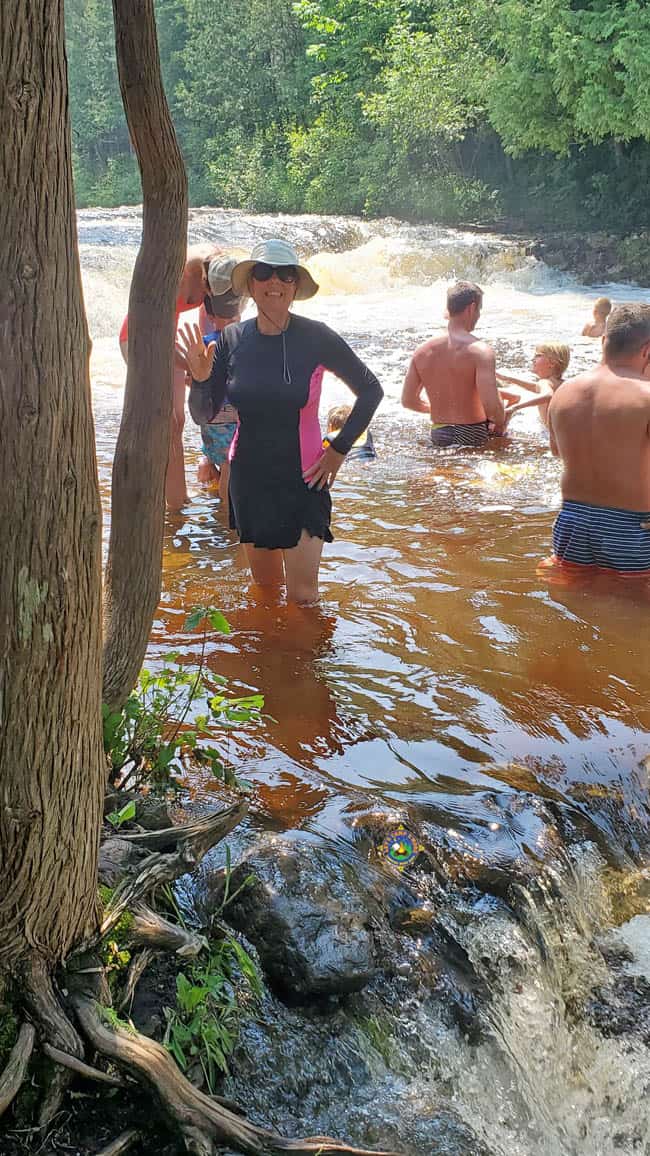 Woman Standing in the Water at Ocqueoc Falls
