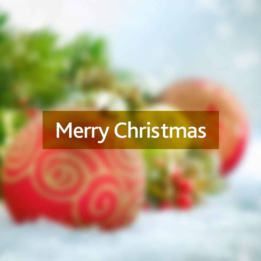 Merry Christmas message on a blurred Christmas bauble background