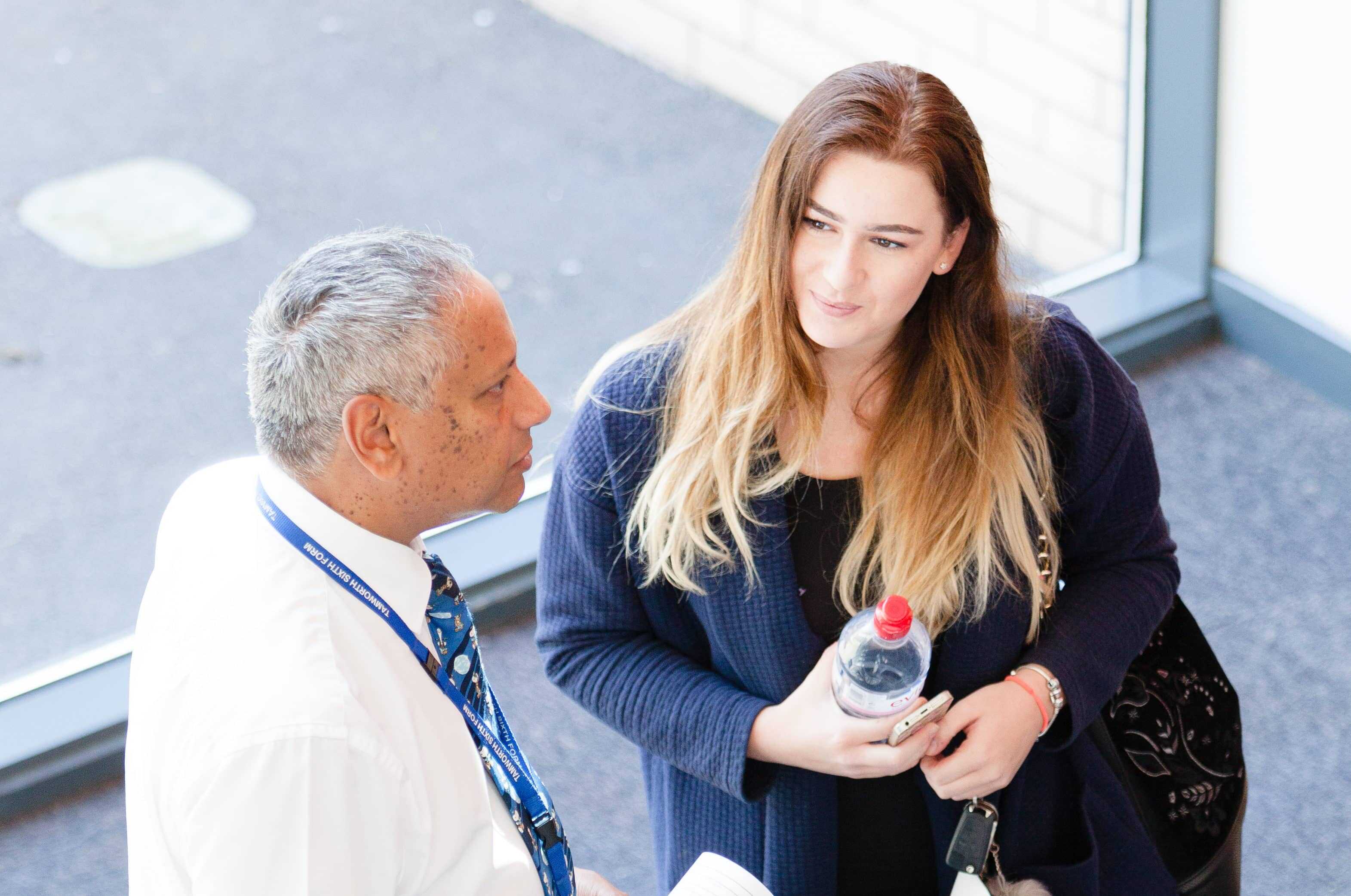 Landau Forte Academy Tamworth Sixth Form teacher talking with a student