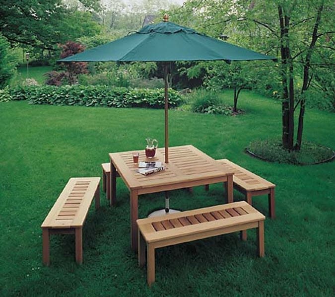 Outdoor-Umbrella-Table-Plan-in-Teds-Woodworking outdoor table and chairs, outdoor table with umbrella outside on green grass