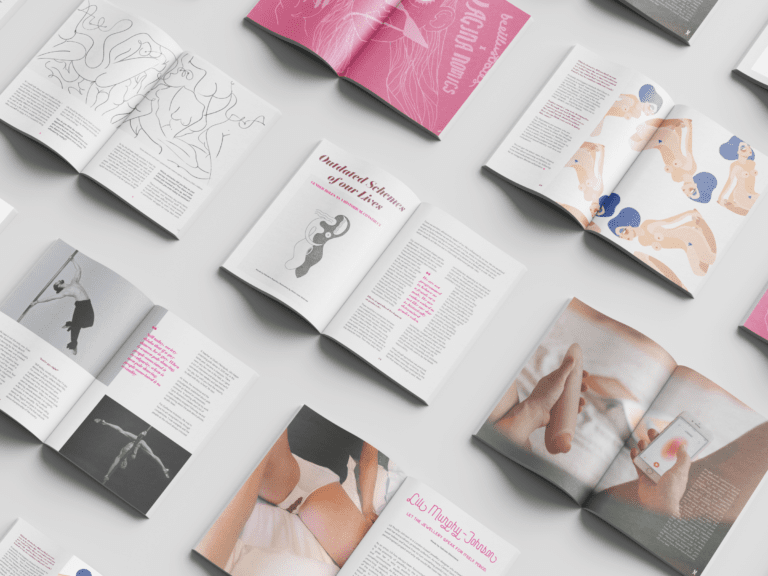 Open magazines laid out in a grid on a grey surface. Each magazine features vibrant images and text, showcasing abstract art, dancer photos, and diverse articles. Covers and pages highlight an array of colours with pink and blue accents.