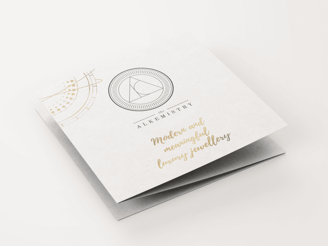 A concertina with the logo of the Alkemistry and golden planet illustration on it