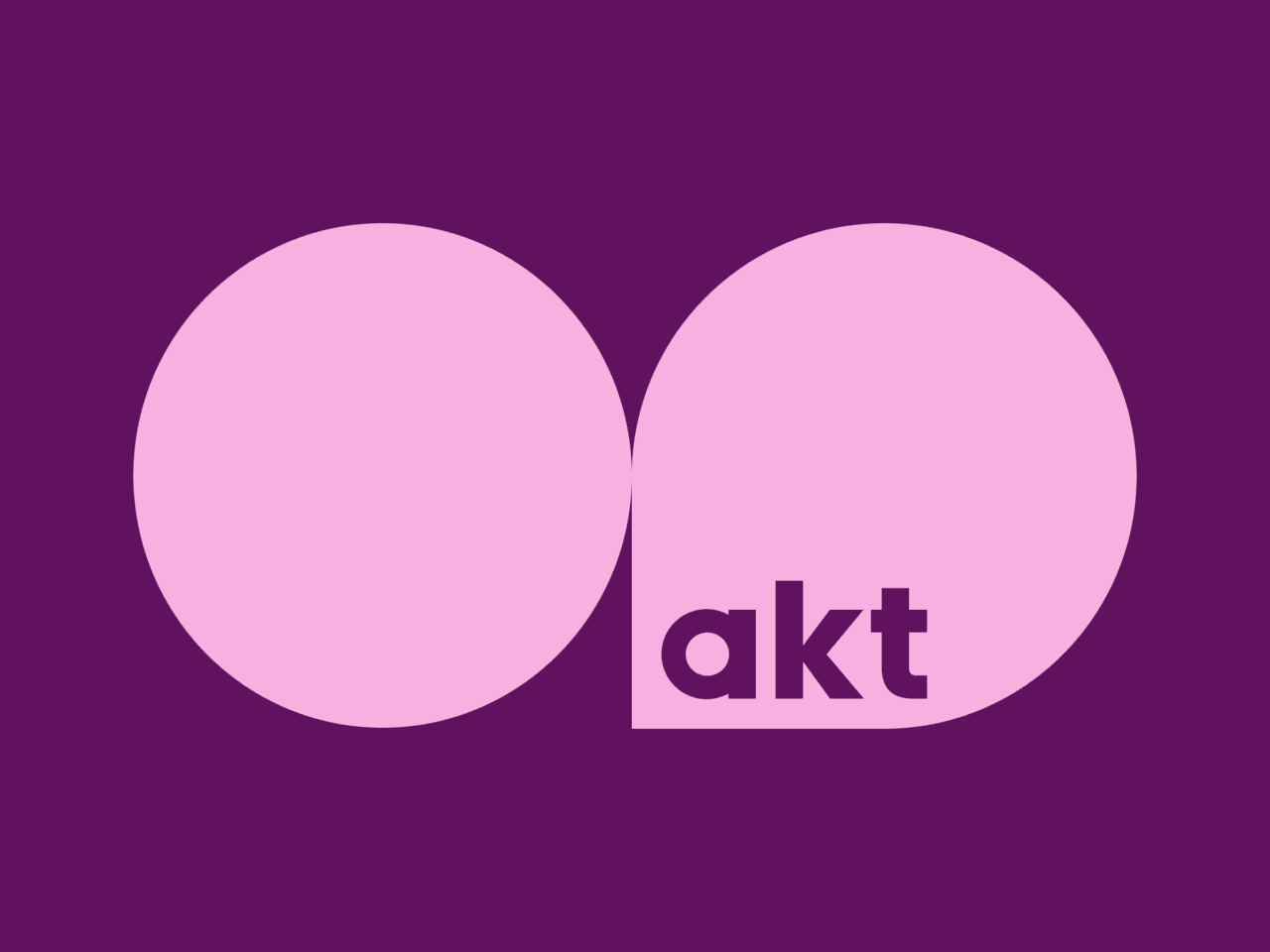 Purple background with two prominent pink shapes: a circle on the left and a teardrop on the right, featuring lowercase letters akt inside the teardrop.
