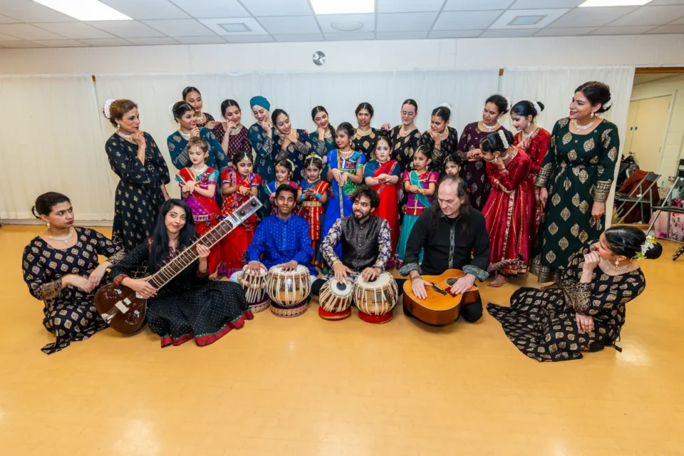 large group of dancers with musicians