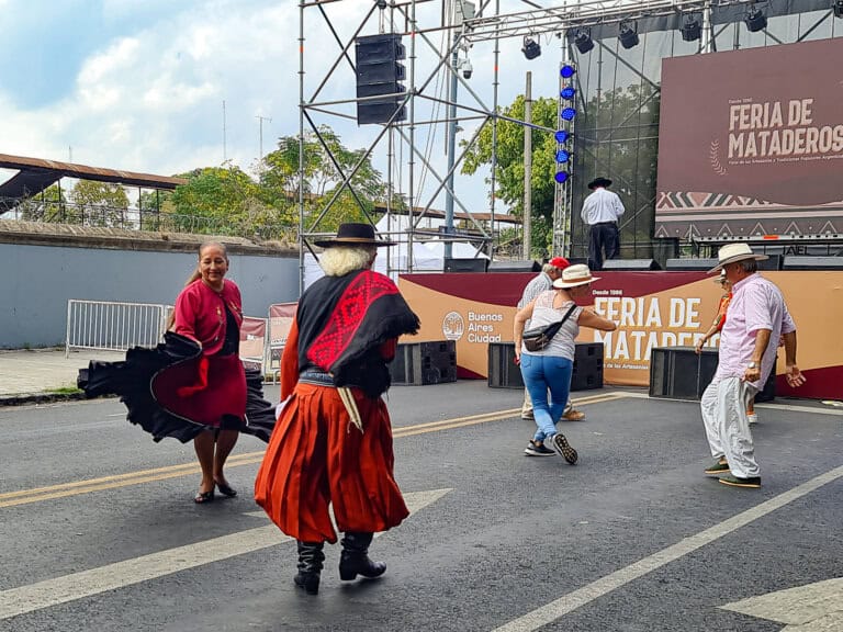 Traditional dancers performing at Feria de Mataderos, a vibrant and off-the-beaten-path cultural fair in Buenos Aires. This unique event celebrates Argentine heritage with live folk music, traditional dances, artisanal crafts, and regional cuisine, offering visitors an authentic glimpse into the country’s rural traditions and gaucho culture.