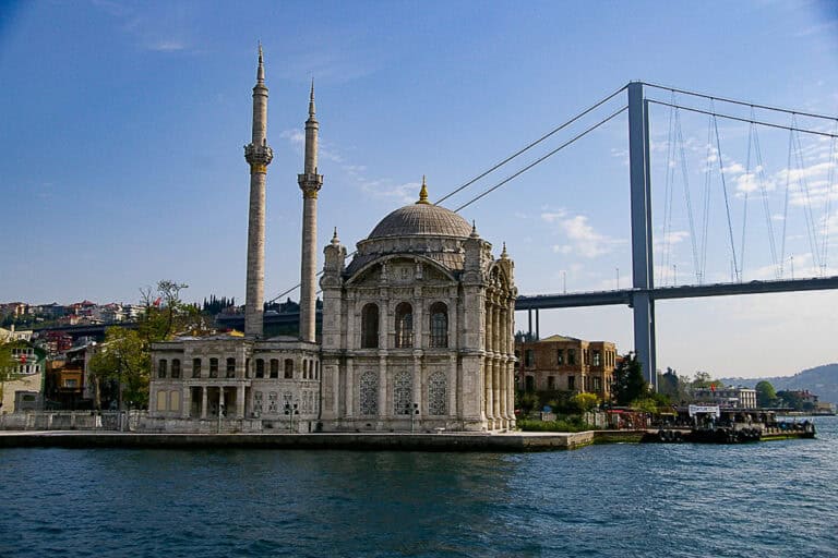 Ortaköy Mosque by the Bosphorus with the Bosphorus Bridge in the background, a must-see Istanbul landmark accessible via ferry or bus.