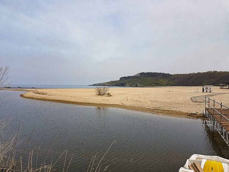 At Silistar Beach a calm body of water meets a wide expanse of sandy beach, creating a natural lagoon-like setting. Silistar is one of the most tranquil Bulgarian beaches.
