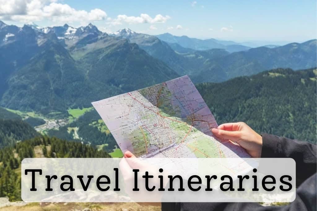 Traveler holding a map with a breathtaking view of green valleys and snow-capped mountains in the background, symbolizing well-planned travel itineraries for scenic destinations.