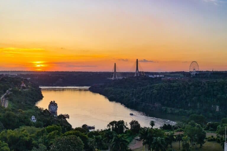 Scenic sunset view of the Parana River, Tres Fronteras, and the bridge connecting Argentina and Brazil as seen from O2 Hotel Iguazu.