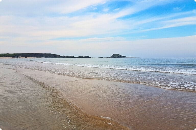 Serene and untouched beach with soft golden sand and gentle waves along the Bulgarian Black Sea Coast.