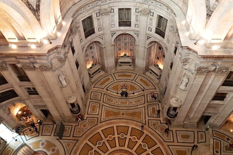 Expansive marble interior of the National Pantheon in Lisbon, Portugal, showcasing ornate domed ceilings, statues, and tombs—must‑visit for history enthusiasts exploring top things to do in the city.