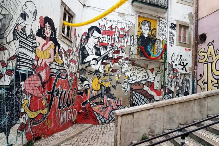 Vibrant street art in Lisbon featuring Fado musicians, colorful murals, and urban culture. Exploring Lisbon’s street art scene is a great free activity for art lovers and photographers.