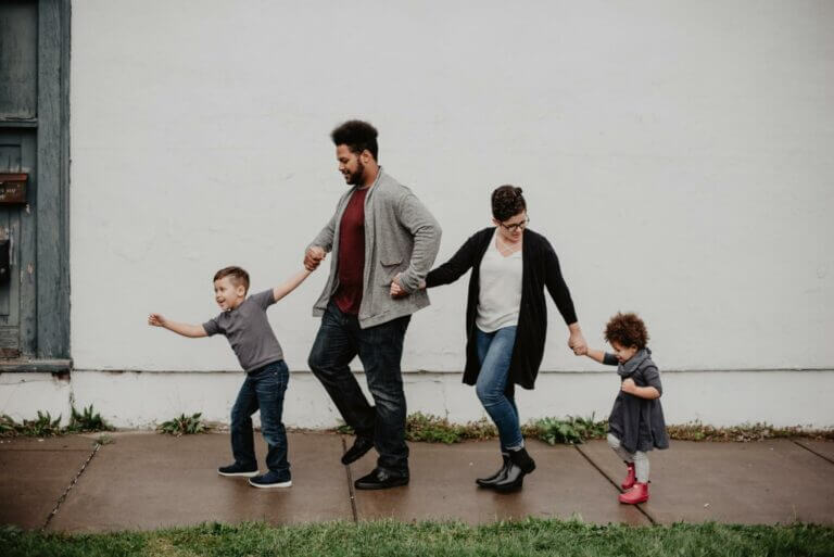 family of four walking at the street 2253879 scaled 1