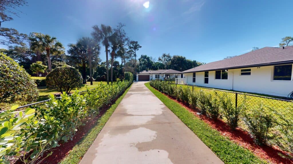 home addition with driveway leading to it