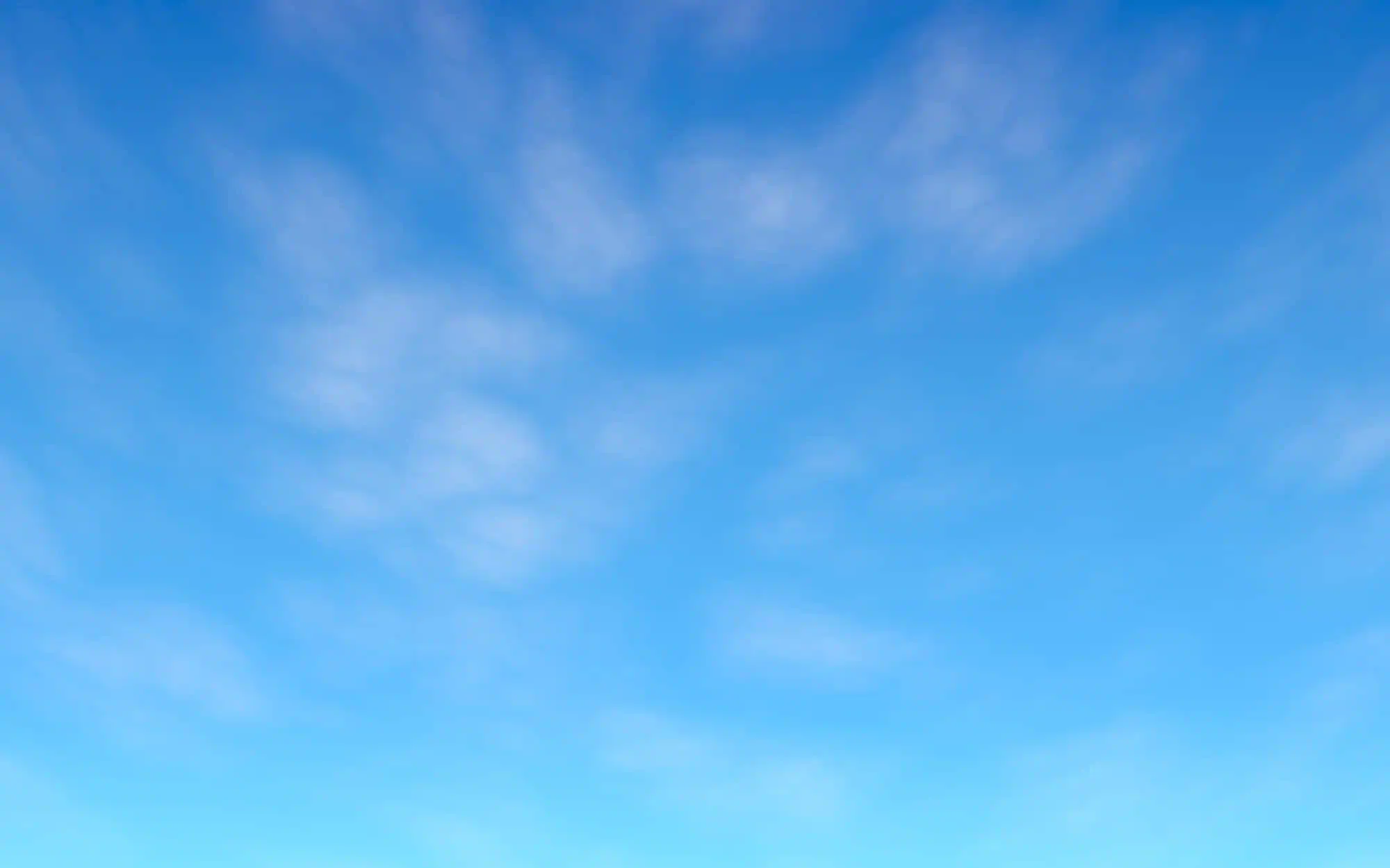 A beautiful blue sky with a few light high clouds