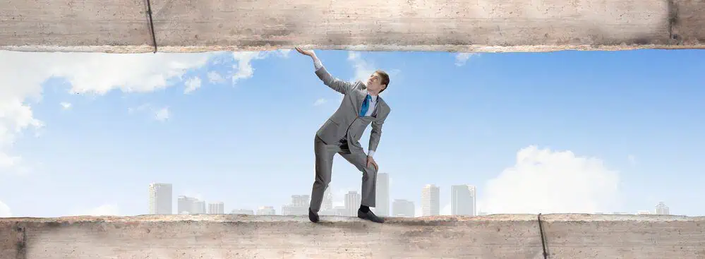 Businessman overcoming obstacles along a path to success