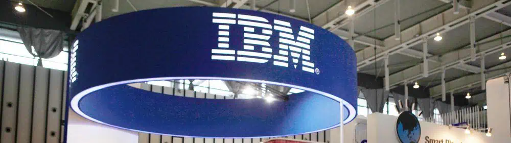 IBM banner above a stand at a computer trade show
