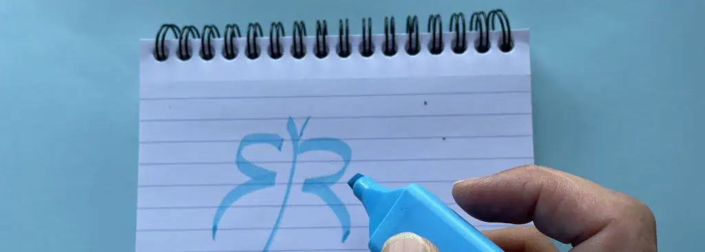 Man drawing personal branding for coaches on paper