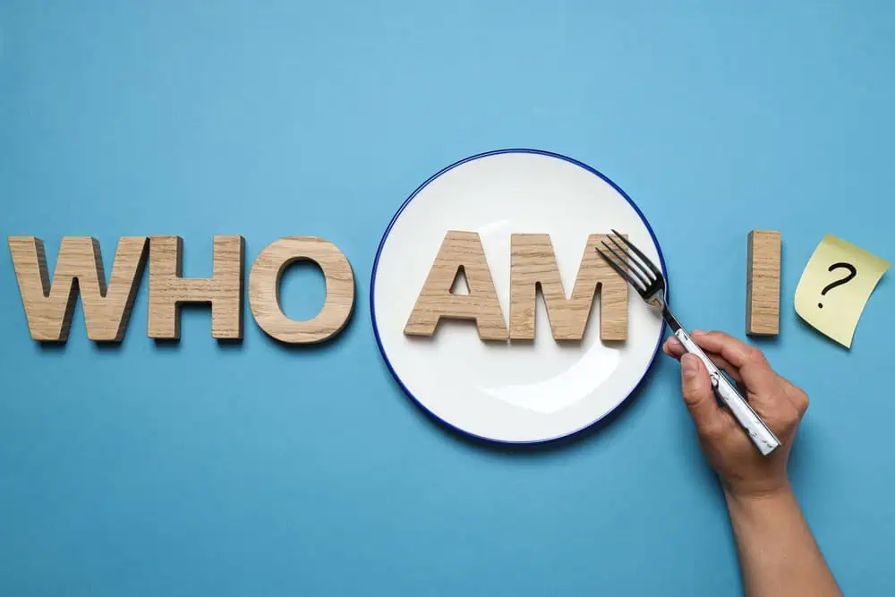 "Who am I?" written out in wooden blocks
