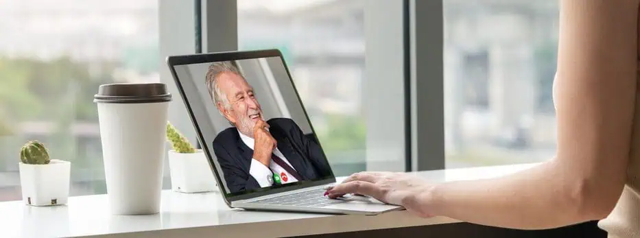A woman teaching a client from her online coaching business for seniors