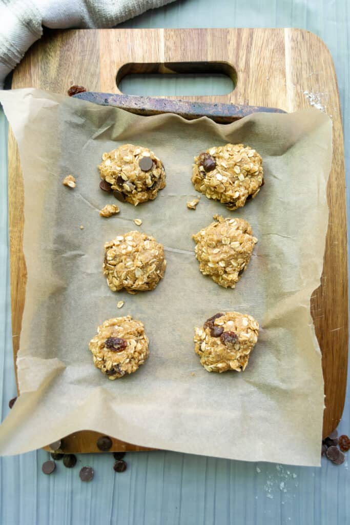 oatmeal raisin chocolate chip cookie dough on a baking tray
