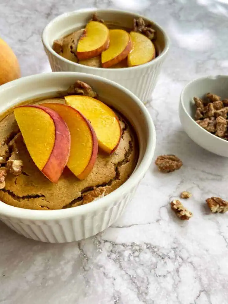 close up view of peach baked oatmeal and nuts