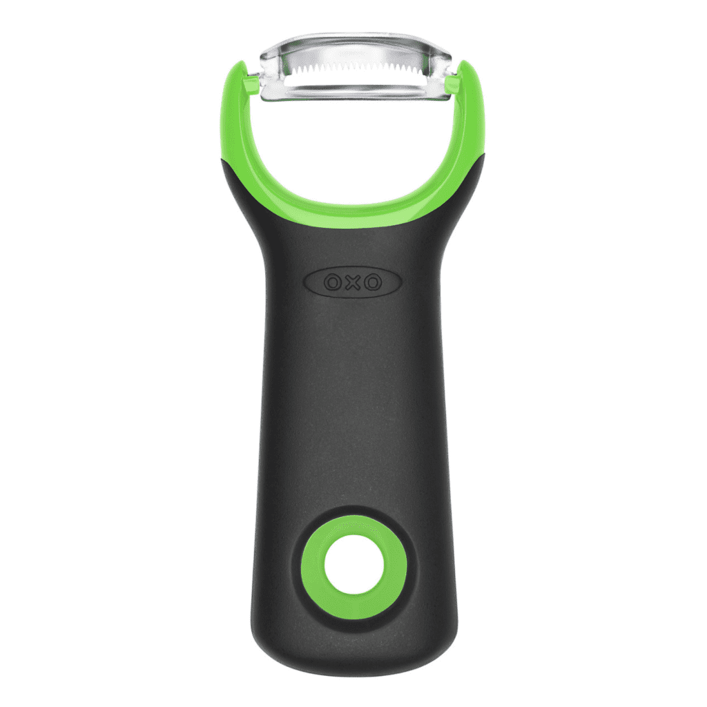 Asparagus peeler made by the brand OXO on a white background.
