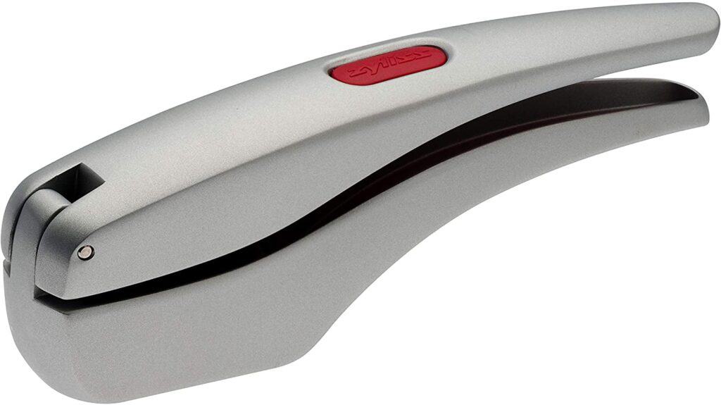 Sliver garlic press on white background. 