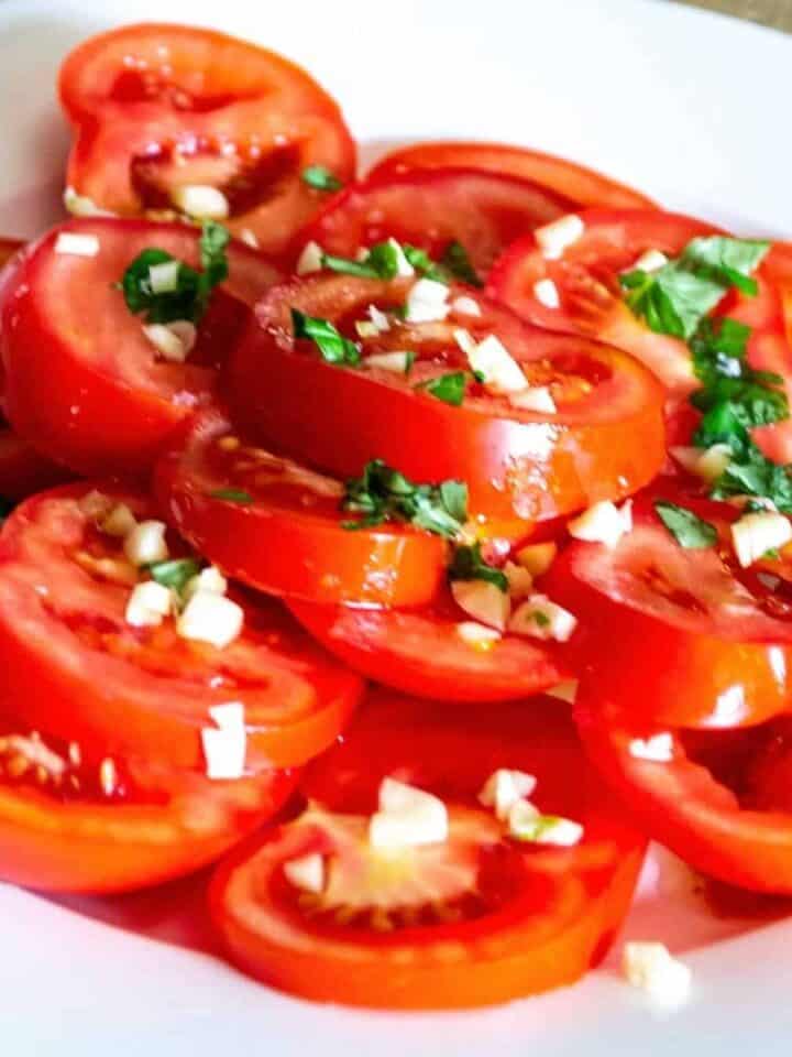 Image thumbnail showing tomato salad on a plate.
