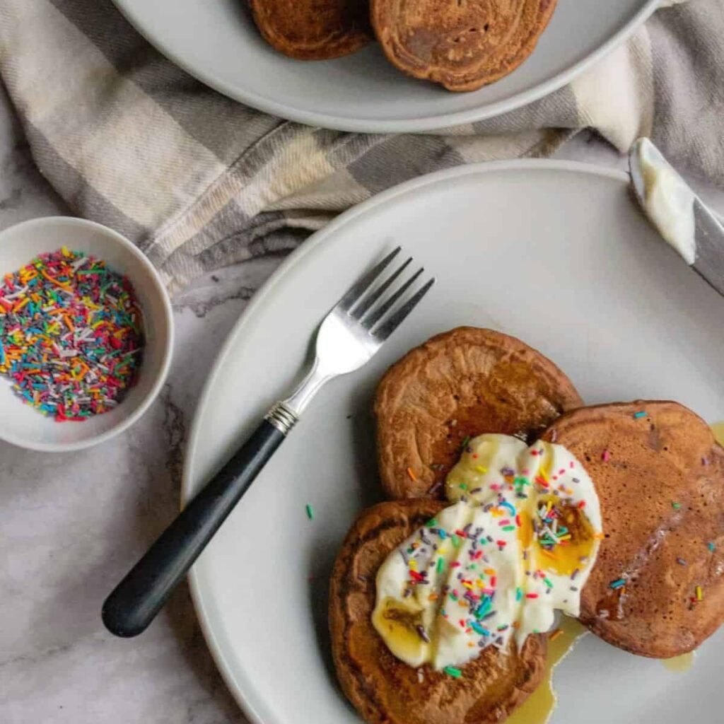 Healthy chocolate pancakes on a plate.