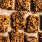 Chocolate chip pumpkin oatmeal bars on a baking tray.