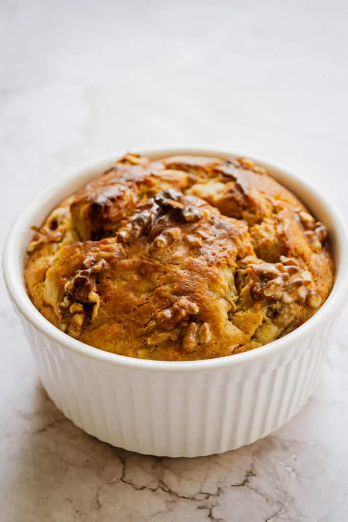 Side view of a single serving banana bread made with egg.