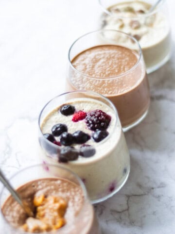 Front view of four flavours of overnight oats in a line.