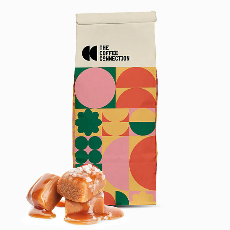 Photo of a bag of The Coffee Connection coffee with salted caramel in the foreground.