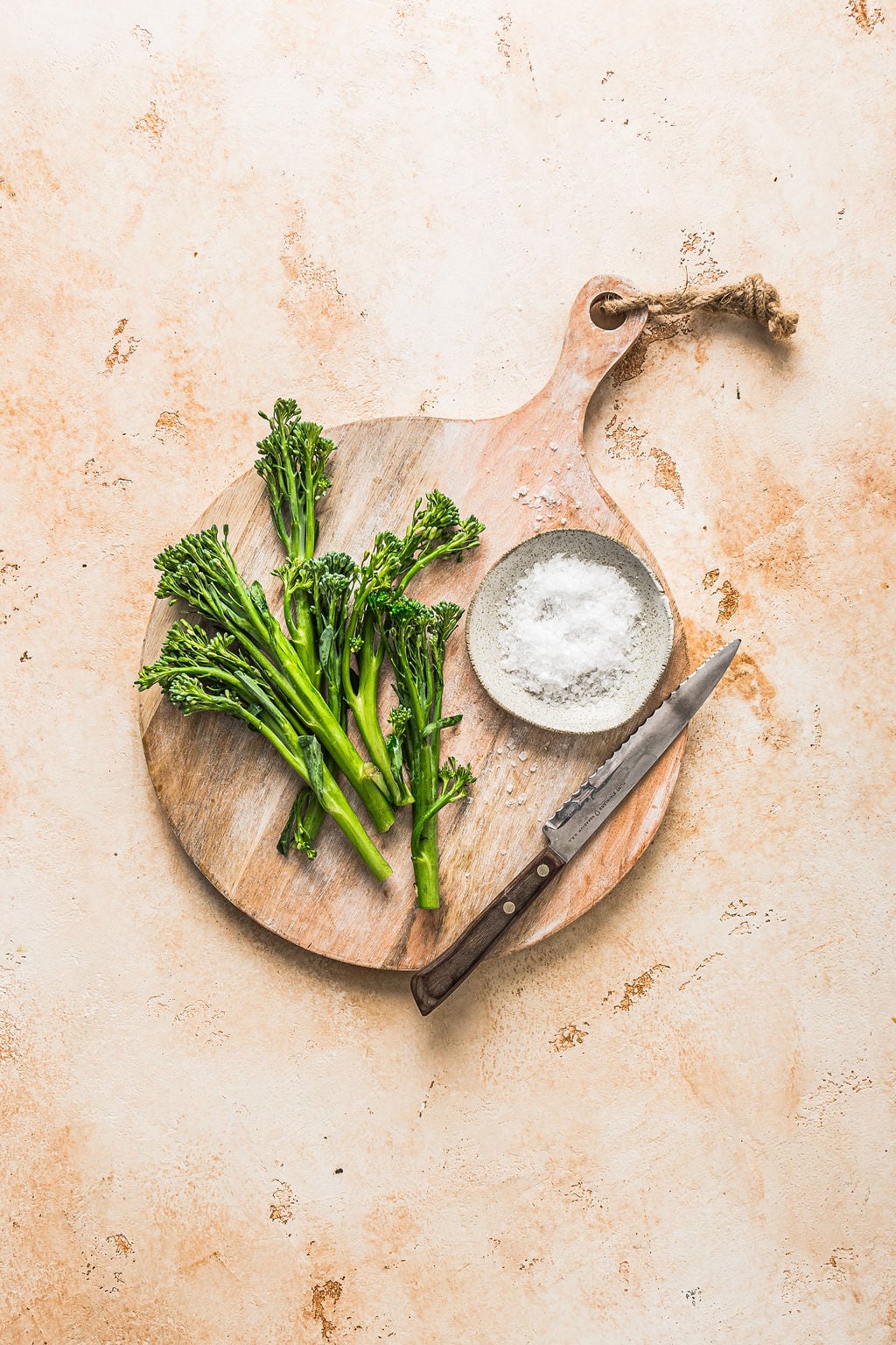 Overhead view of pan fried broccolini ingredients.