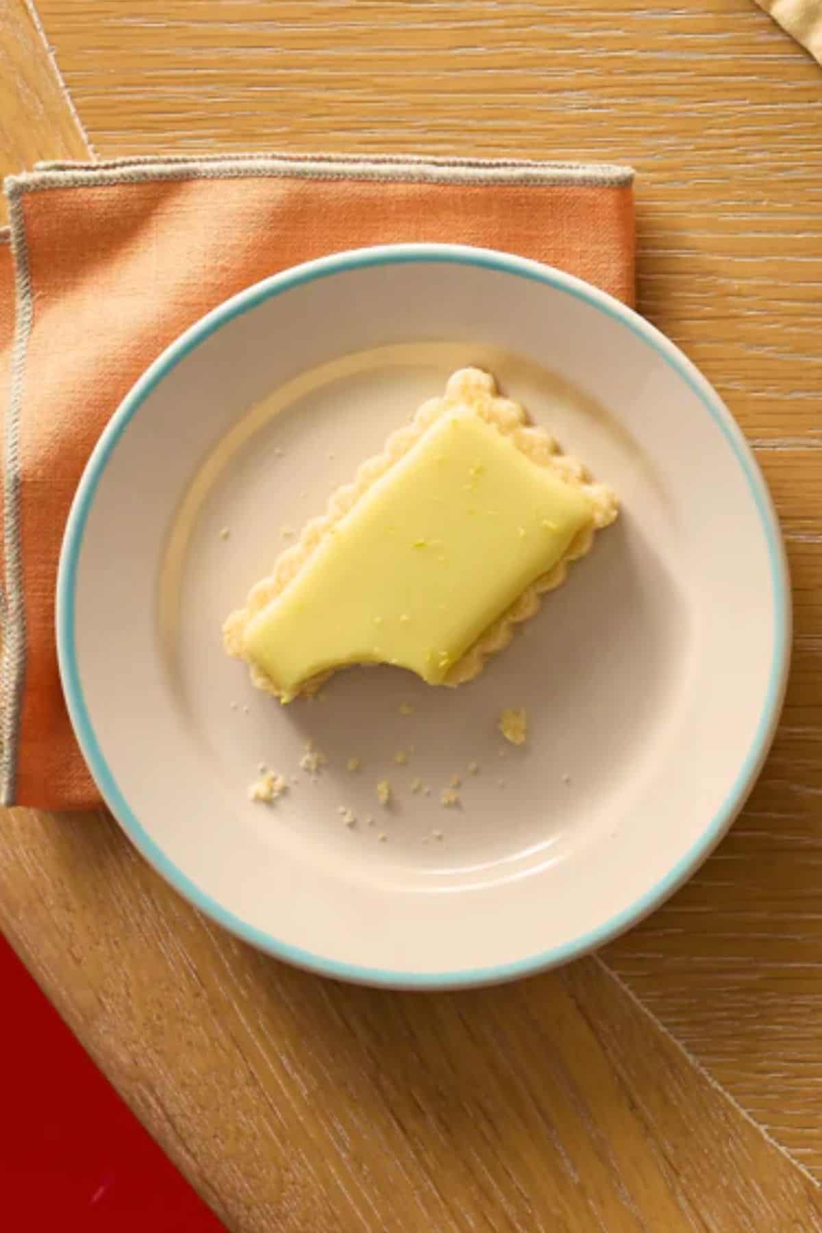 Overhead shot of a yuzu shortbread cookie on a plate.