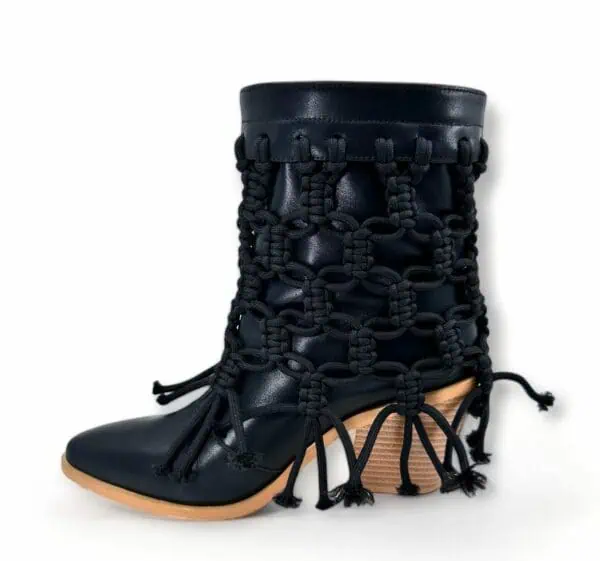 Black licorice: hand-braided black leather boot