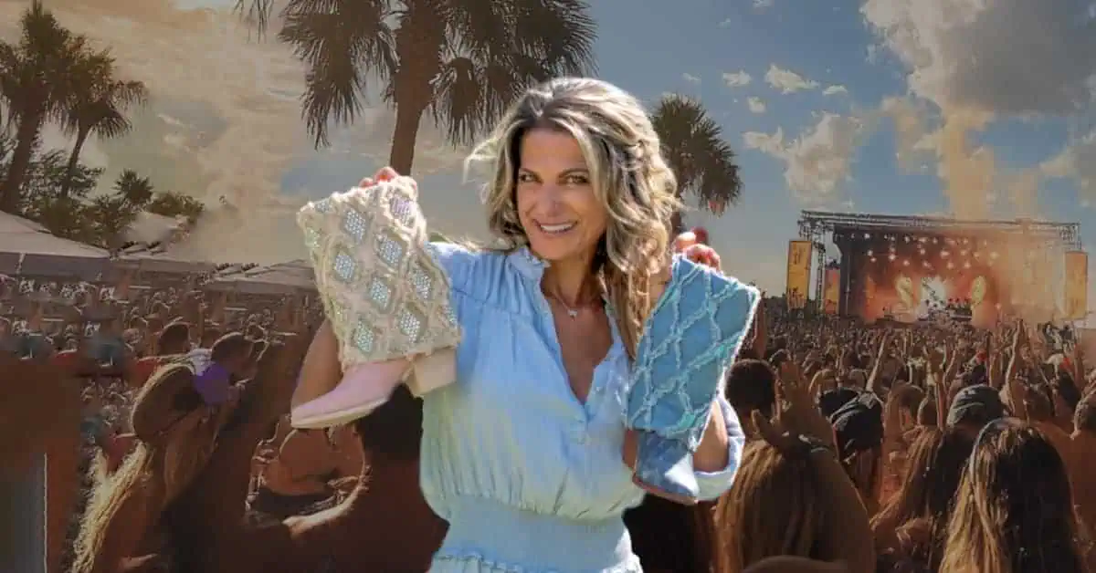 woman holding boots with the Live Fest Concert Festival in the background