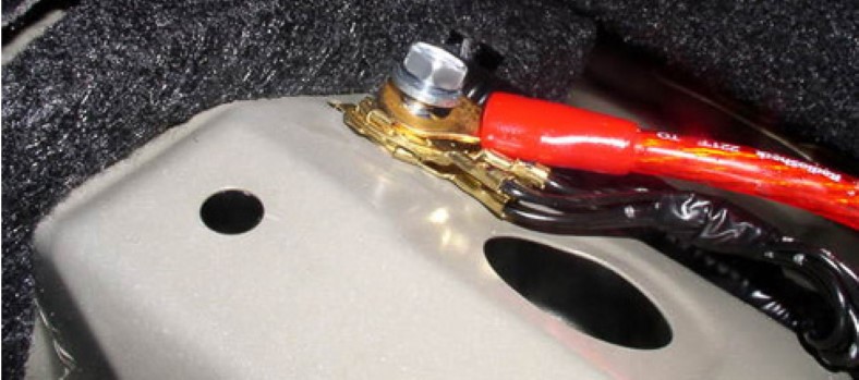 Car amp grounded to factory ground location