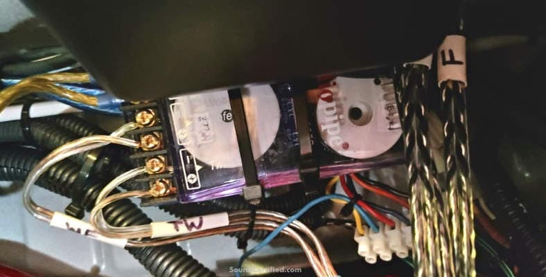 car speaker crossover installation example using wire ties to mount it