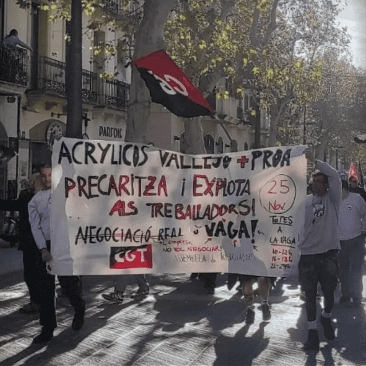 picture of workers at vallejo paint factory marching in protest down the streets of villanova