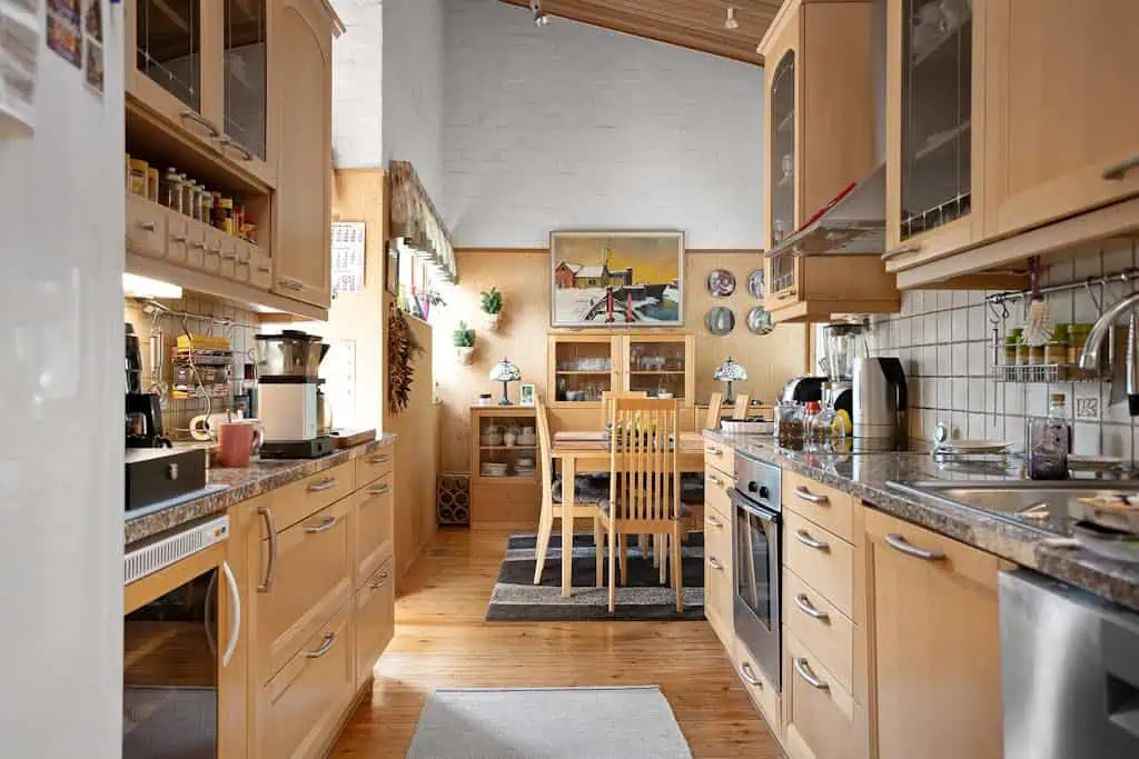 Charming Scandinavian kitchen with rustic wooden elements and cozy dining area.