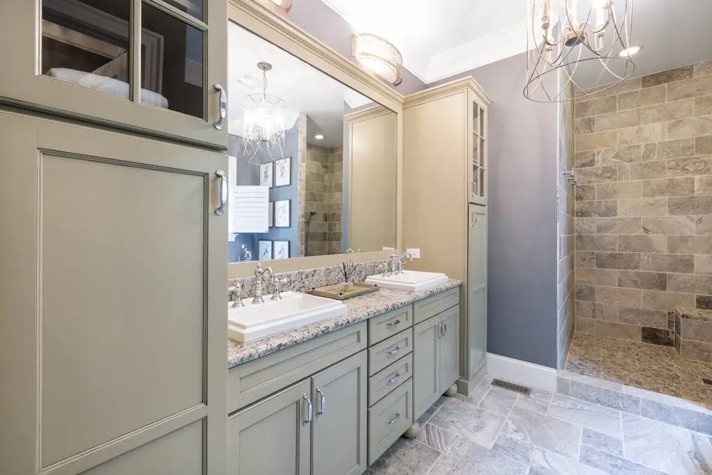 Contemporary bathroom featuring stylish cabinetry and a sleek walk-in shower.