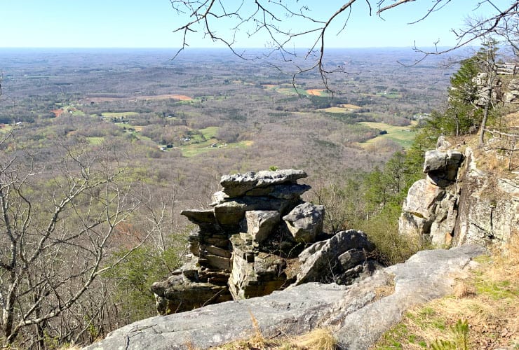 Views of the Yadkin Valley and Yadkin River below as well as distant views of Greensboro, High Point and Winston-Salem
