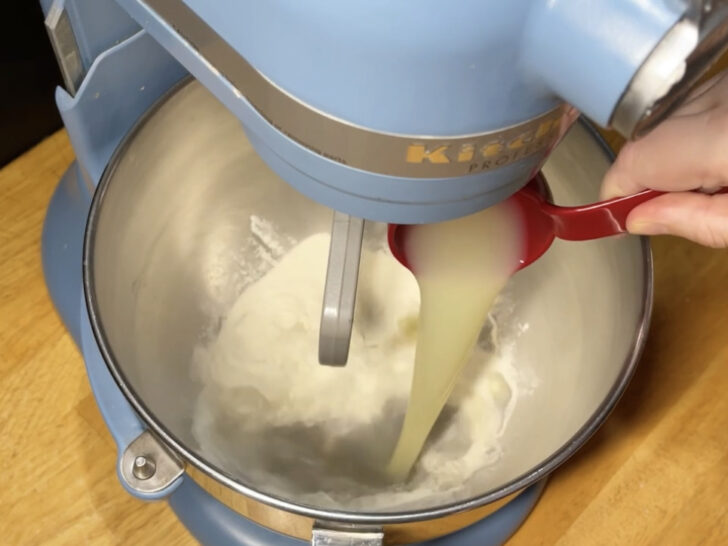 photo of lemon juice being added to meringue powder for royal icing recipe with meringue powder