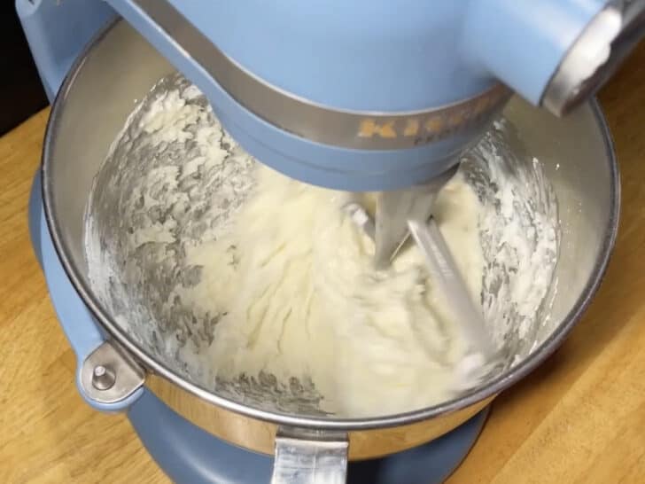 photo of just barely incorporated meringue powder, lemon juice and powdered sugar for royal icing recipe with meringue powder