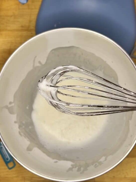 photo of meringue powder mixed with warm water to create a thick beer foam for the first step of making royal icing with meringue powder recipe