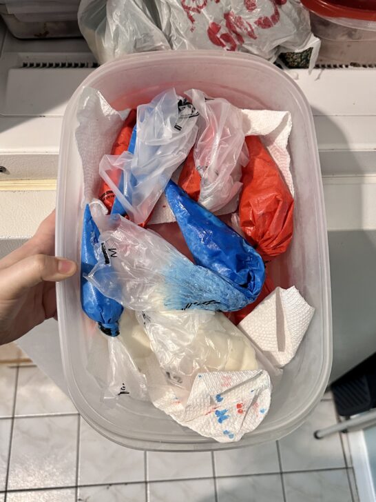 picture of royal icing stored in piping bags in the freezer