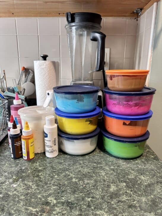 picture of several glass pyrex bowls with plastic lids used for storing royal icing